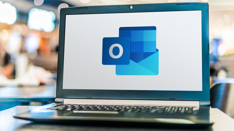Laptop displaying Microsoft Outlook logo