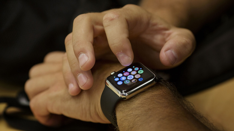 man staring intently Apple watch