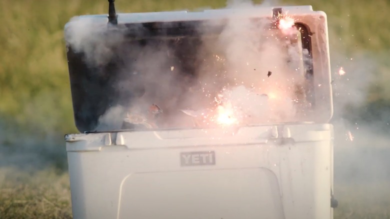 A Yeti cooler being lit up with fireworks.