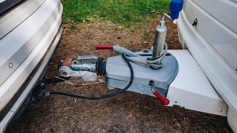 A trailer hitched up to a car