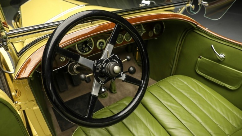 Close up of  Rolls-Royce driver side and green leather