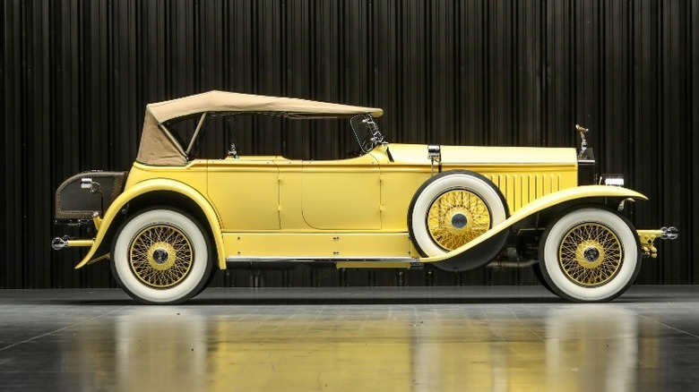 Rolls-Royce in profile on showroom floor