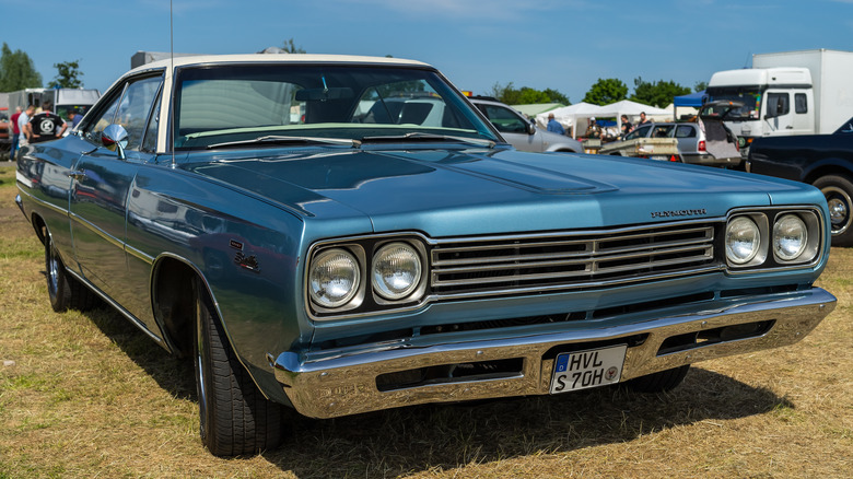 1960s Plymouth Satellite in field