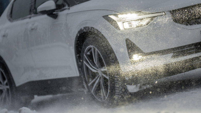 Car driving in snowy conditions