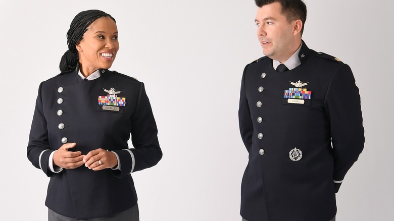 Two Space Force personnel model the prototype dress uniform in 2021