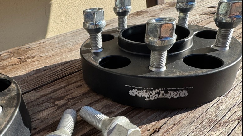 Lug bolts screwed into a black hub