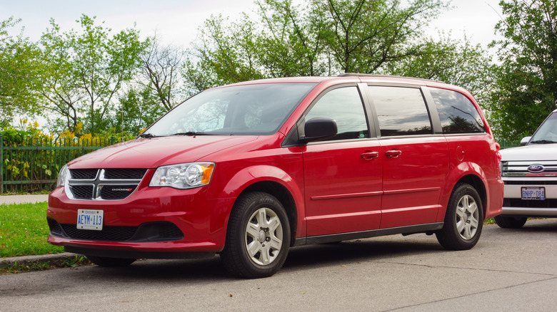 red Dodge Caravan on the street