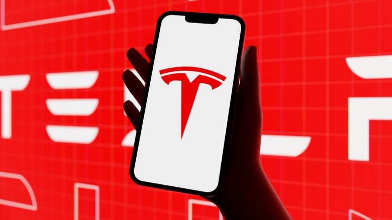 Tesla logo on a smartphone