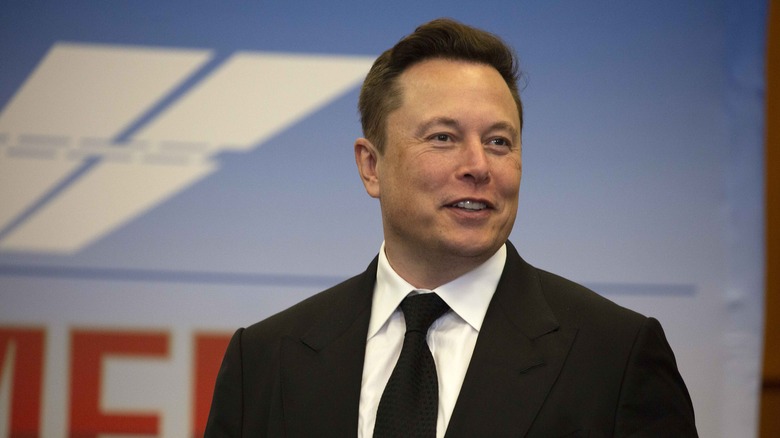 Elon Musk in black suit