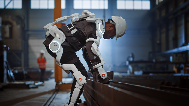 Person bending to lift in exoskeleton