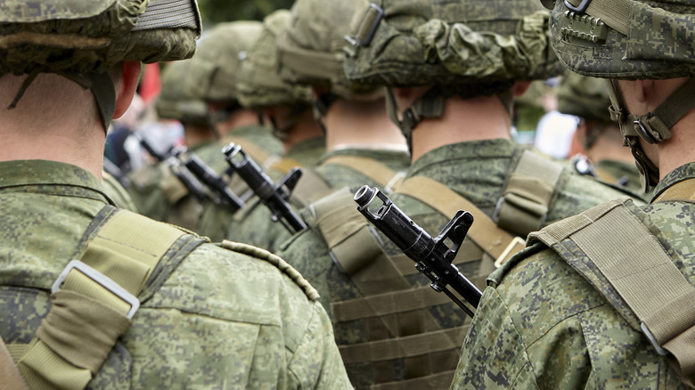 Soldiers in uniform marching together