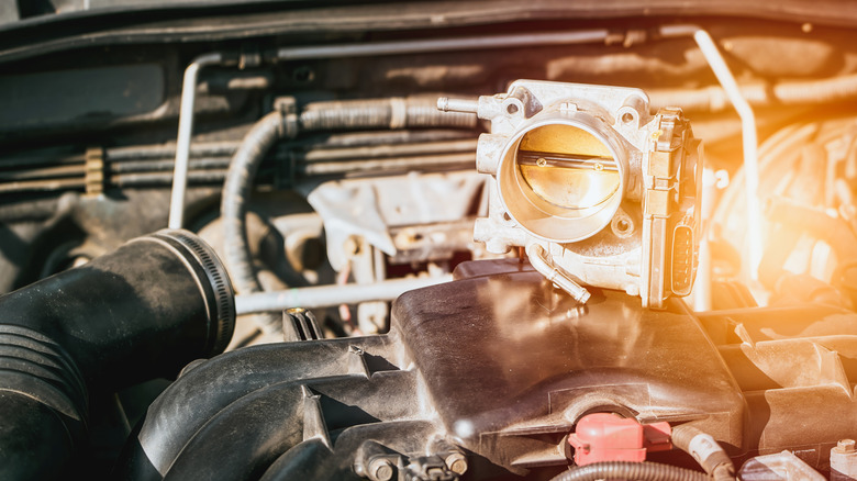 Throttle body sitting on top of engine