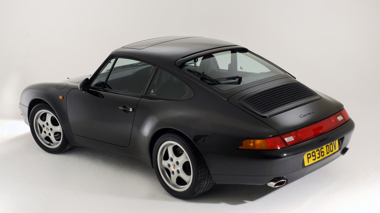 Back side of black Porsche 993 at museum