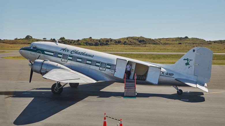 DC-3 on runway with open doors