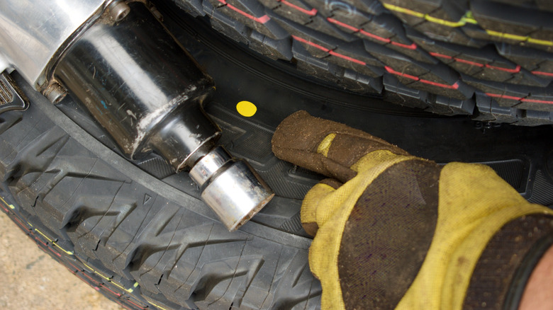 A brand new tire with yellow dot