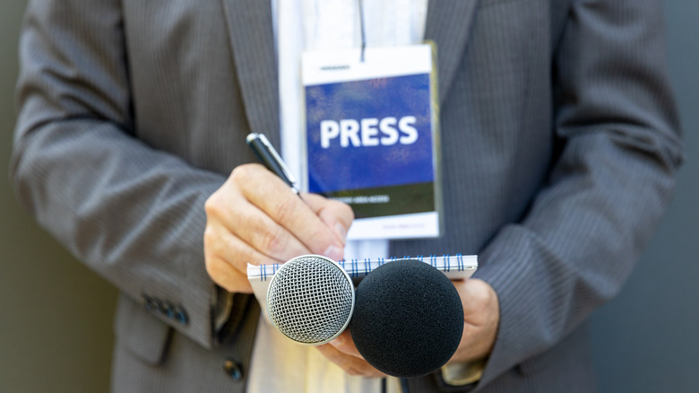 Journalist with press badge