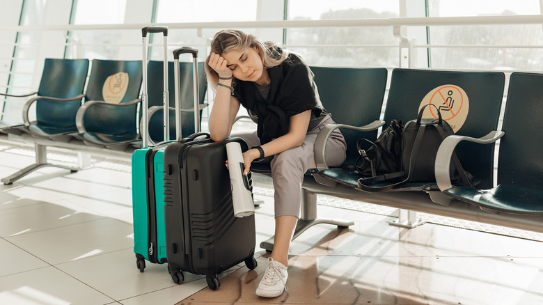 Tired passenger at an airport