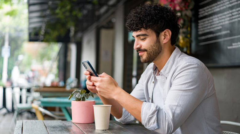 Man sending text message