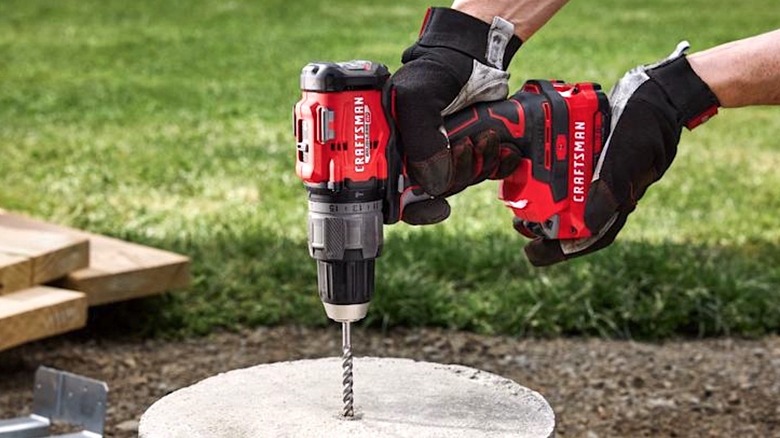 Person using Craftsman hammer drill