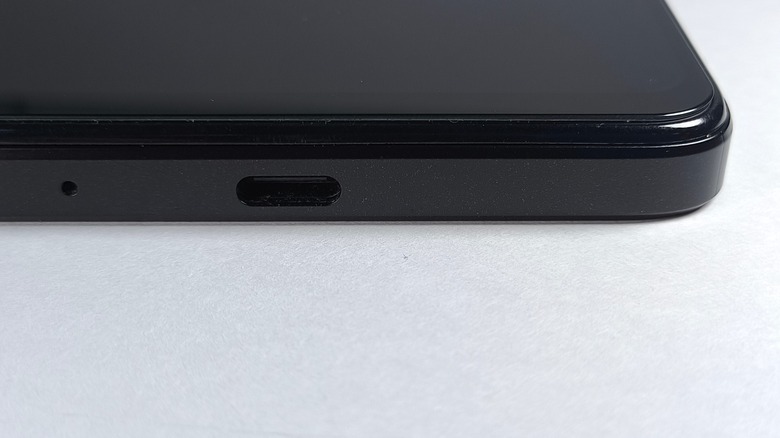 Close up view of the hole next to charging port