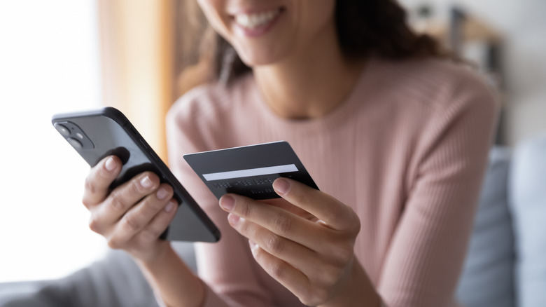 Woman looks at phone