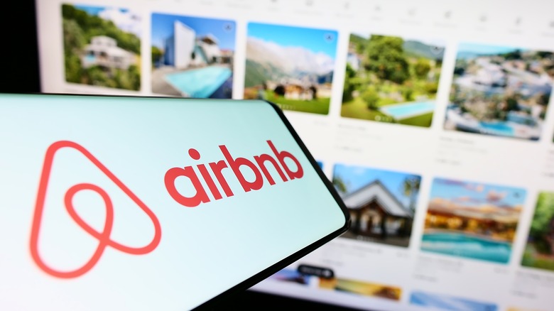 Airbnb logo on a phone