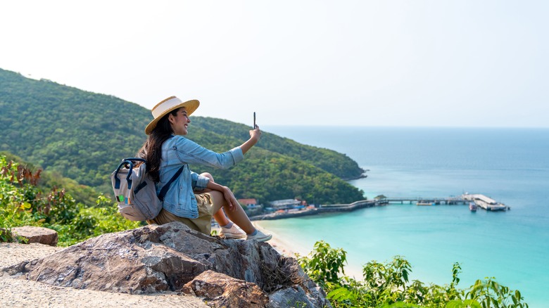 Woman taking a picture.