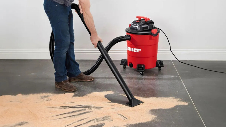 Cleaning up sand with the Bauer wet/dry vacuum