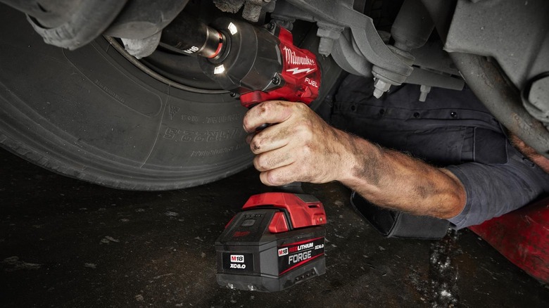 Mechanic using Milwaukee 2967-20 M18 Fuel 1/2 Inch High Torque Impact Wrench