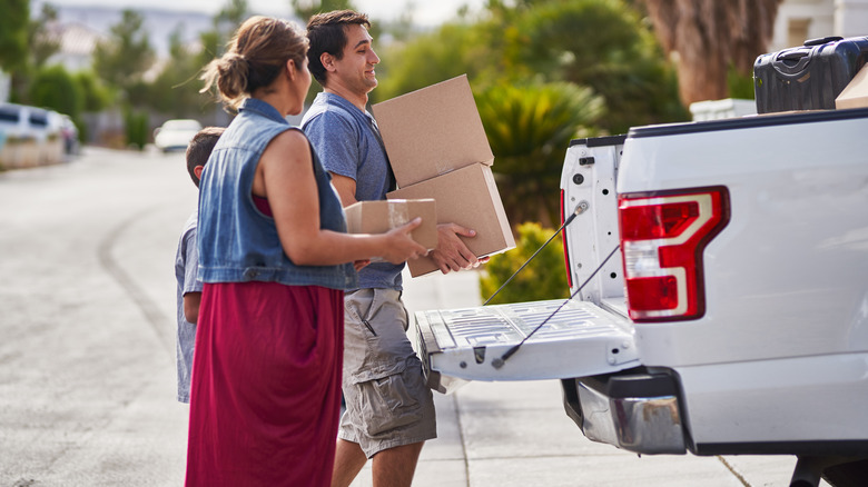 A family loads their pickup