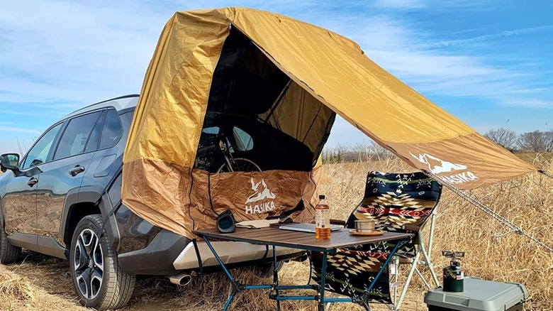 SUV and tent outdoors