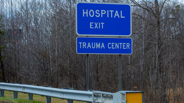 Blue hospital and trauma center exit sign