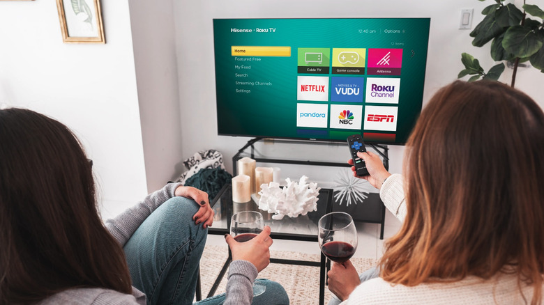 Two women looking at Hisense TV home screen