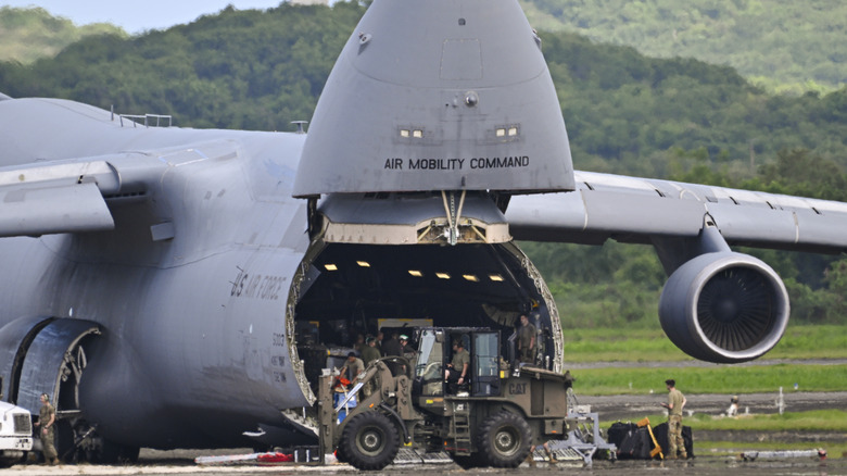 U.S. Air Force service members unloading cargo from a Boeing C-5 Galaxy at former Naval Station Roosevelt Roads in 2025