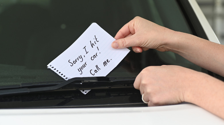A person leaving a note on another vehicle with their information following an accident