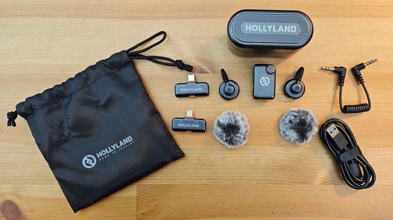 Hollyland Lark M2S on a wooden table with all of its various components.
