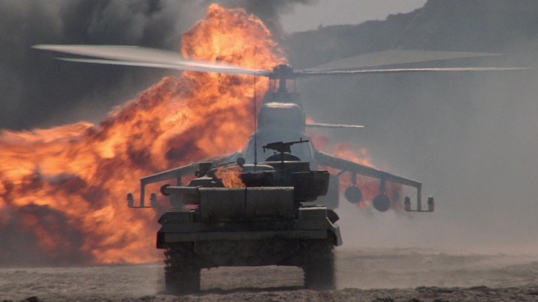 Rambo charging a tank into a helicopter