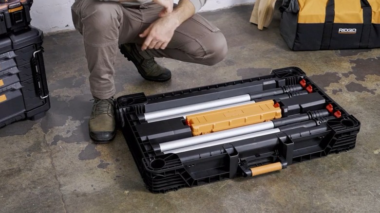 Home Depot's Ridgid portable work table with legs and clamps stored in the table base.