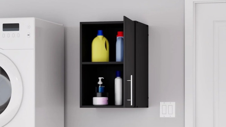 Prepac Elite Wood Freestanding Garage Cabinet mounted on laundry room wall