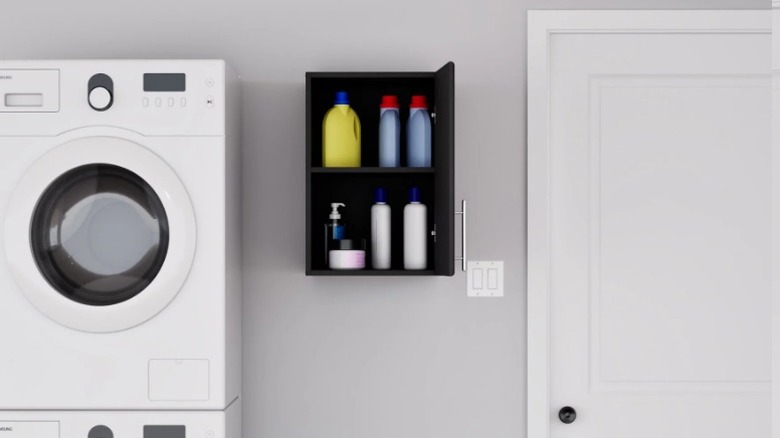 Prepac Elite Wood Freestanding Garage Cabinet mounted on laundry room wall