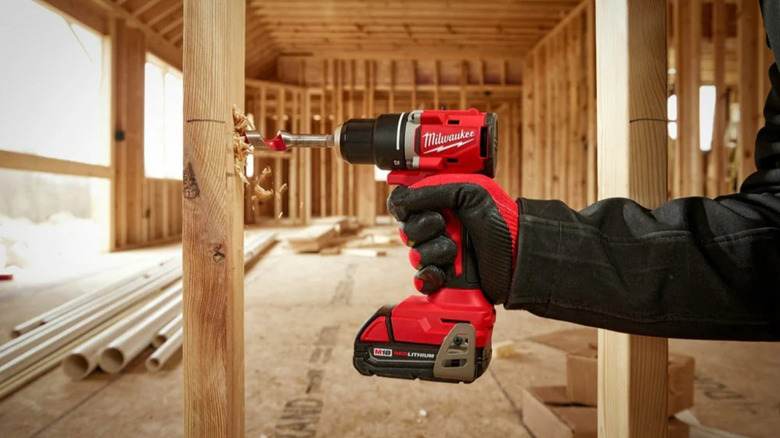 Person drilling into wood with a Milwaukee M18 Compact Drill/Driver