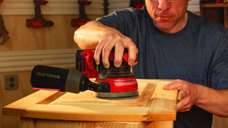 sanding a cabinet door with Craftsman sander