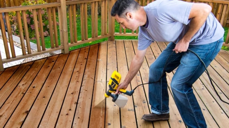 staining deck with Wagner sprayer