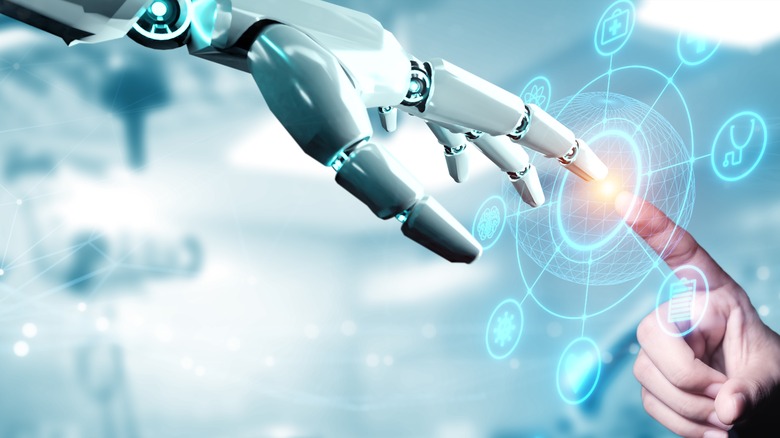 robot and human fingers touching