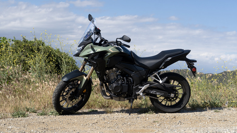Honda CB500X profile with flowers and dirt