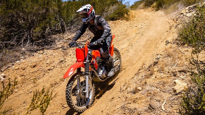 Person riding CRF250F on trail