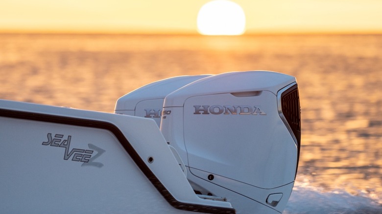 Two of Honda's BF350 outboard motors at sunset