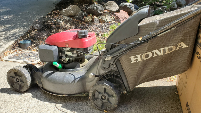 Honda lawn mower on pathway