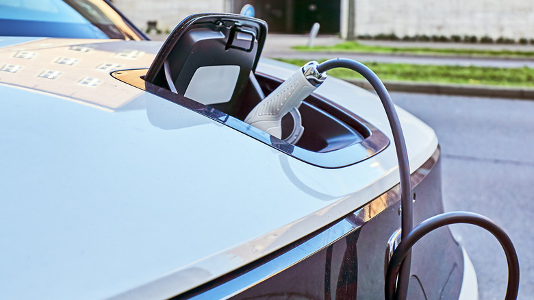 Close-up of a Honda electric vehicle charging.