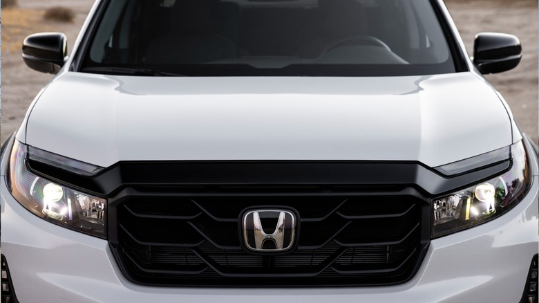 Close-up of a white Honda Ridgeline front fascia